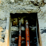 Two buried pipes underground