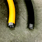Yellow and black corrugated stainless steel tubing