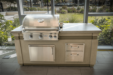 High-end outdoor grill island with concrete grey base.